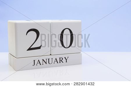 January 20st. Day 20 Of Month, Daily Calendar On White Table With Reflection, With Light Blue Backgr