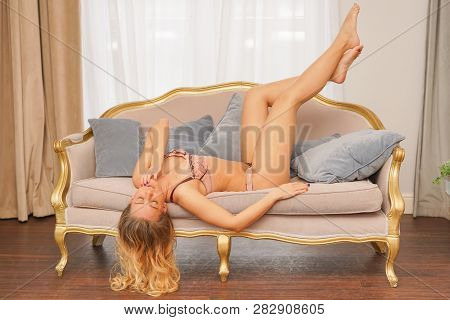 Beautiful Caucasian Blonde Girl In Pink Lace Lingerie