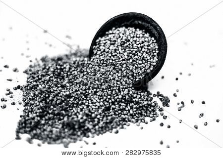 Close Up Of Grains Of Pearl Millet Or Bajra Or Pennisetum Glaucum In A Clay Bowl Isolated On White.