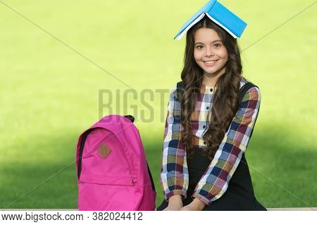 Feeding Your Brain With Reading. Happy Child Hold Book On Head. Reading Education. Book Learning. Sc