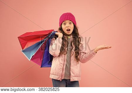 Falling Prices. Surprised Shopper Presenting Product Pink Background. Small Child On Shopping Sale. 
