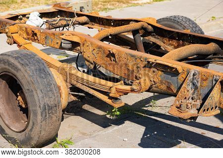 Old Rusty Car Frame, Shock Absorber, Truck Wheel.