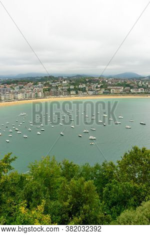 view of the city of San Sebastian, with La Concha beach, from Mount Urgull. Summer vacation scene in Spain