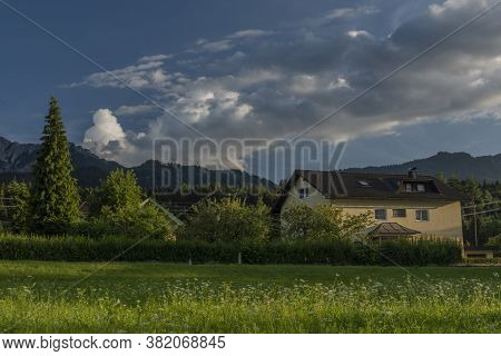 Color Evening With Cloudy Blue Sky In Ledenitzen Village In South Austria