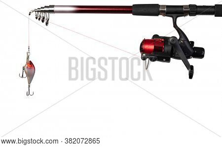 Spinning rod, reel and fishing baits isolated on white background