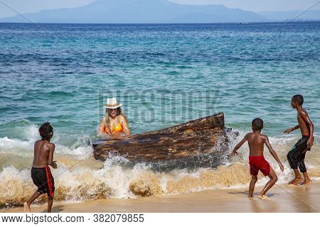 Papua New Guinea, Jayapura, August, 15, 2019 - Indonesian Funny Children With A White Lady Playing W
