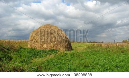 cloud before a rain and a haycock