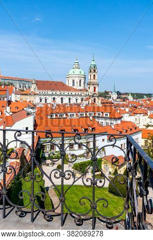 Prague Castle And St Nicholas Church In Lesser Town Of Prague. Sunny Spring Day View From Vrtba Gard
