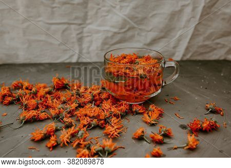 Flower Light Tea In A Transparent Large Cup, Orange Calendula.