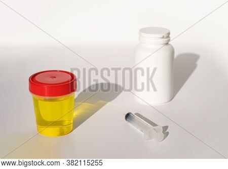 Urine Test, Syringe, White Bottle. Urinalysis, Drug Testing, Drug. Plastic Jars For Medical Tests.. 
