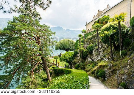 Villa Balbianello. Lake Como. Italy - July 19, 2019: Footpath Following to Famous Tree in Garden at Villa del Balbianello on Lake Como. Italy.