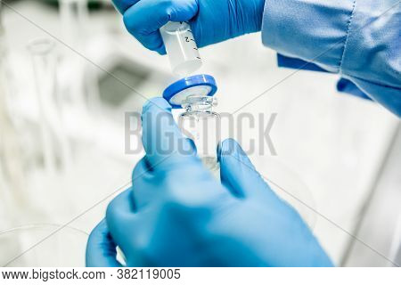 Flask And Pipette In Scientist Hand With Dropping Chemical Liquid To Test Tubes, Science And Medical