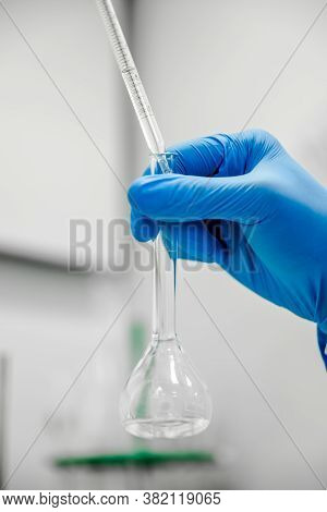Flask And Pipette In Scientist Hand With Dropping Chemical Liquid To Test Tubes, Science And Medical