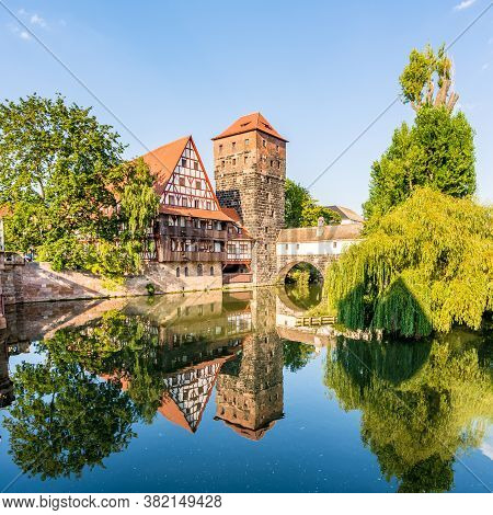 View At The Henker Bridge With Tower Over Pegnitz River In Nuremberg - Germany