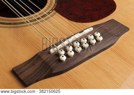 Detail Of The Bridge Of A 12-string Guitar