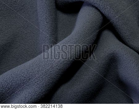 Blanket Made Of Fluffy Fleece Fabric. The Background Is Made Of Soft Plush Fleece Material With A Lo