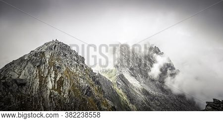 Misty Fagaras Mountains, Romania. Mist Over The Alps Of Transylvania.