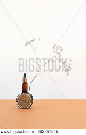 Brown Glass Bottle Dropper With Beauty Cosmetic Serum Salubrious Oil From Wooden Cut On Beige Backgr