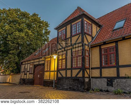 Half-timbered House In The Breaking Morning Light On A Cobblestone-street In The Small Town Faaborg,