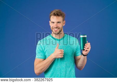 Happy Man Show Thumbs Up With Gel Bottle On Violet Background. Bearded Man Like Shampoo Tube On Purp
