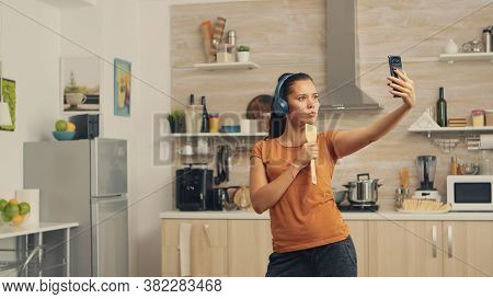 Happy Woman Taking A Selfie In The Morning While Singing Using Spoon. Energetic, Positive, Happy, Fu
