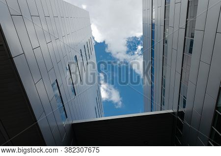 Katowice, Silesia, Poland; July 12th, 2020: Corporate Building With A Modern Facade Against Pictures