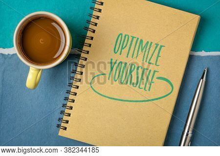 optimize yourself inspirational note - handwriting in a sketchbook with a cup of coffee, self improvement and personal development concept