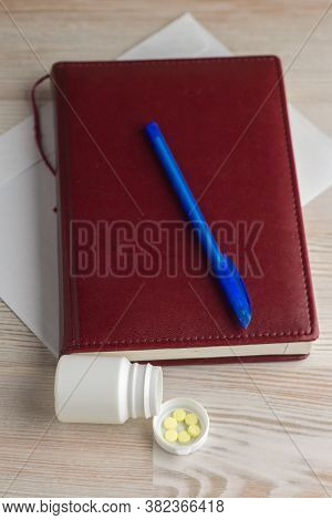 Ensuring Good Employee: A Pack Of Tablets Of Ephedrine. Next Lay On A Wooden Table An Envelope, A No