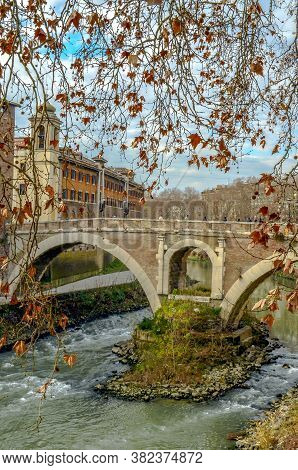 Ponte Fabricio And Tiber River With Autumn Leaves