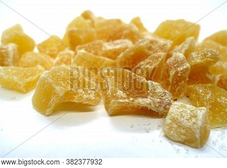 Succade From Ginger On White. Food And Ingredients Background.