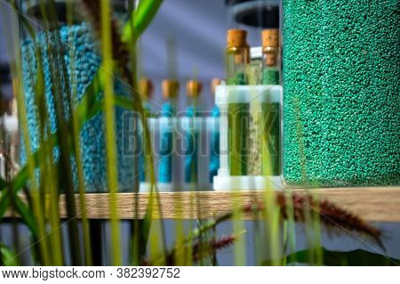 Multi-colored Granules Of Micronutrient Fertilizer In Test Tubes In A Row