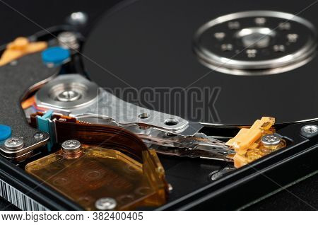 Disassembled Laptop Hard Disk Drive, Hdd. Close-up. Opened Hard Drive, Magnetic Heads And Disk Plate