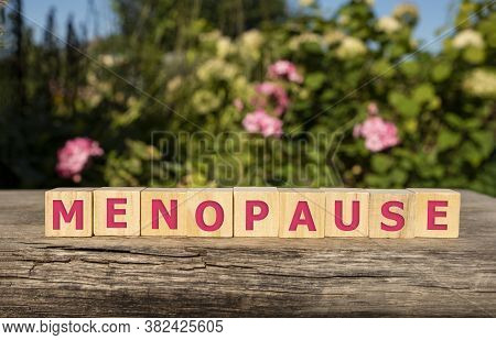 Menopause Word Written On Wood Block. Menopause Text On Table, Concept