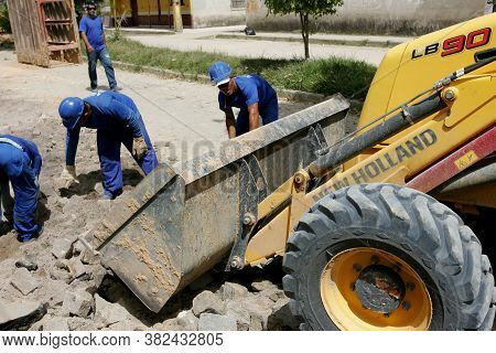 Eunapolis, Bahia / Brazil - November 17, 2010: Backhoe Machine Works On The Implementation Of A Sewa