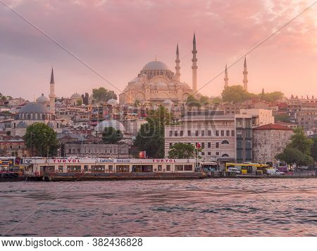Istanbul, Turkey - May, 23, 2019: Sunset Shot Of The Ferry Terminal On The Waterfront And A Mosque I