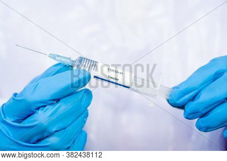 Doctor, Scientist, Researcher Hand In Blue Gloves Or Protective Suit Preparing For Human Clinical In