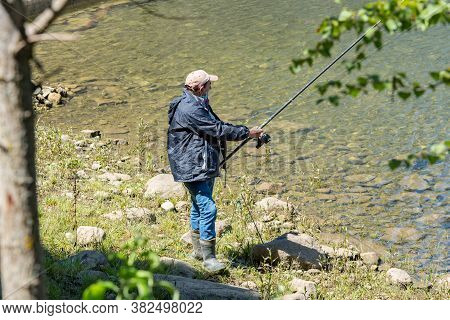 Escaldes Engodany, Andorra : 20 August 2020 : Fisherman In The Engolasters Lake  In Escaldes Engorda