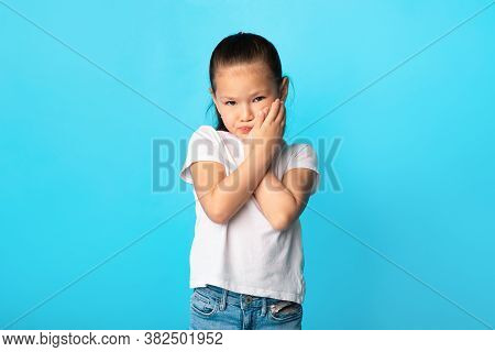 Tooth Disease Concept. Unhappy Asian Girl Having Gum Problems, Touching Her Cheek, Isolated Over Blu