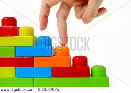 Step By Step To The Top. Business Concept Of Successful Financial Growth. The Womans Hand Steps On T