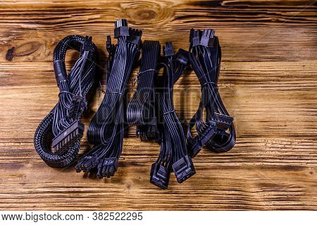 Set Of Computer Psu Cables On Wooden Background