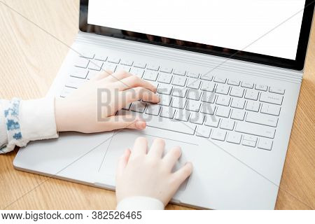 Placeit - Child Uses A Computer For School Work