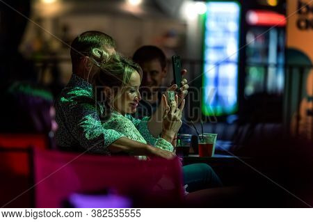 Odessa, Ukraine - Cirka 2020: Spectators At Concert In Theater Take Pictures Of Performance Of Their