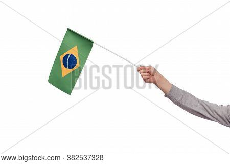 Hand Holding Brazil Flag Isolated On White Background. Ordem E Progresso.