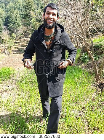 Smiling Man - Portrait Of A Handsome Indian Guy Wearing Duffle Coat