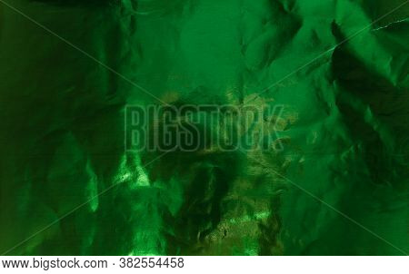 Crumpled Textured Foil With Color Highlighting. Textured Paper. Green Colour.