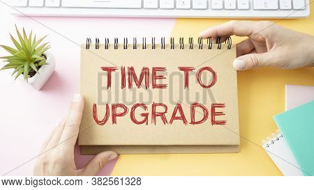 Businessman Holding A Card With Text Time To Update