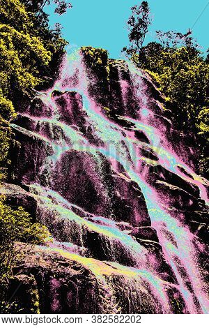 Waterfall Amid A Forest In Itatiaia, An Altitude Park Known For Its Animal Diversity And Trails In S