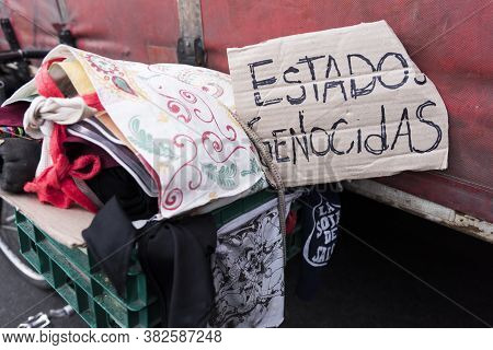 Caba, Buenos Aires / Argentina; Aug 23, 2019: Poster With The Text Genocidal States. Protest In Fron