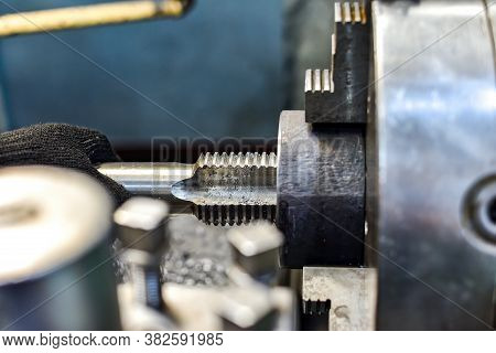 Tapping On A Lathe, The Tap Cuts The Hole By Applying Pressure From The Tailstock