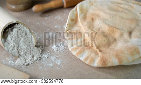 Kuboos Or Khubz - Arabic Bread On A Brown Table In The Kitchen Kitchen